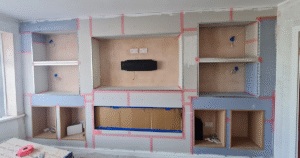Custom-built media wall with electric fireplace and LED lighting